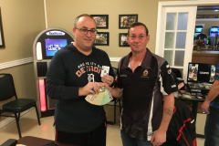 Darren Bailey (right) presenting Steff Thouin (left) with the $2022 jackpot.   