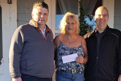 Bonnie 'Bon Bon' Lamont with Emerald Community Centre Manager Kent Croken and PEI Darts Association President Stephen Clow presenting Bonnie her winnings
